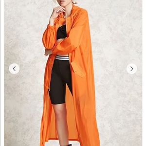 Long orange hooded windbreaker